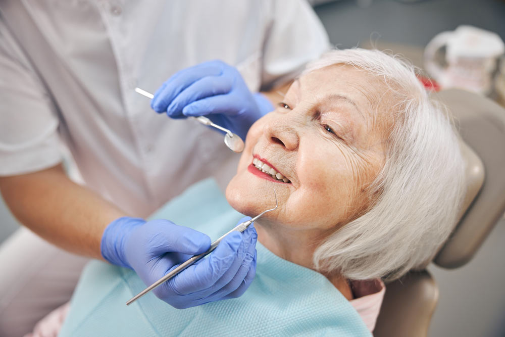 older woman getting a dental checkup